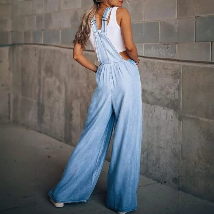 Blue stylish denim jumpsuit on the model