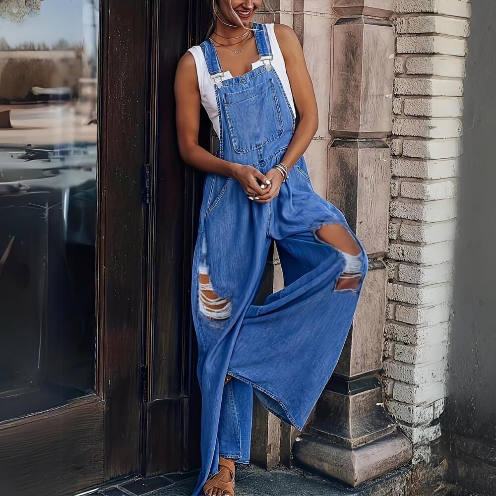 Dark blue stylish denim jumpsuit on the model