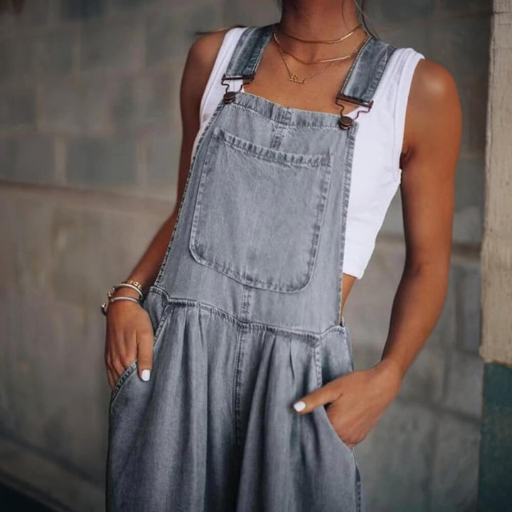 Grey stylish denim jumpsuit on the model