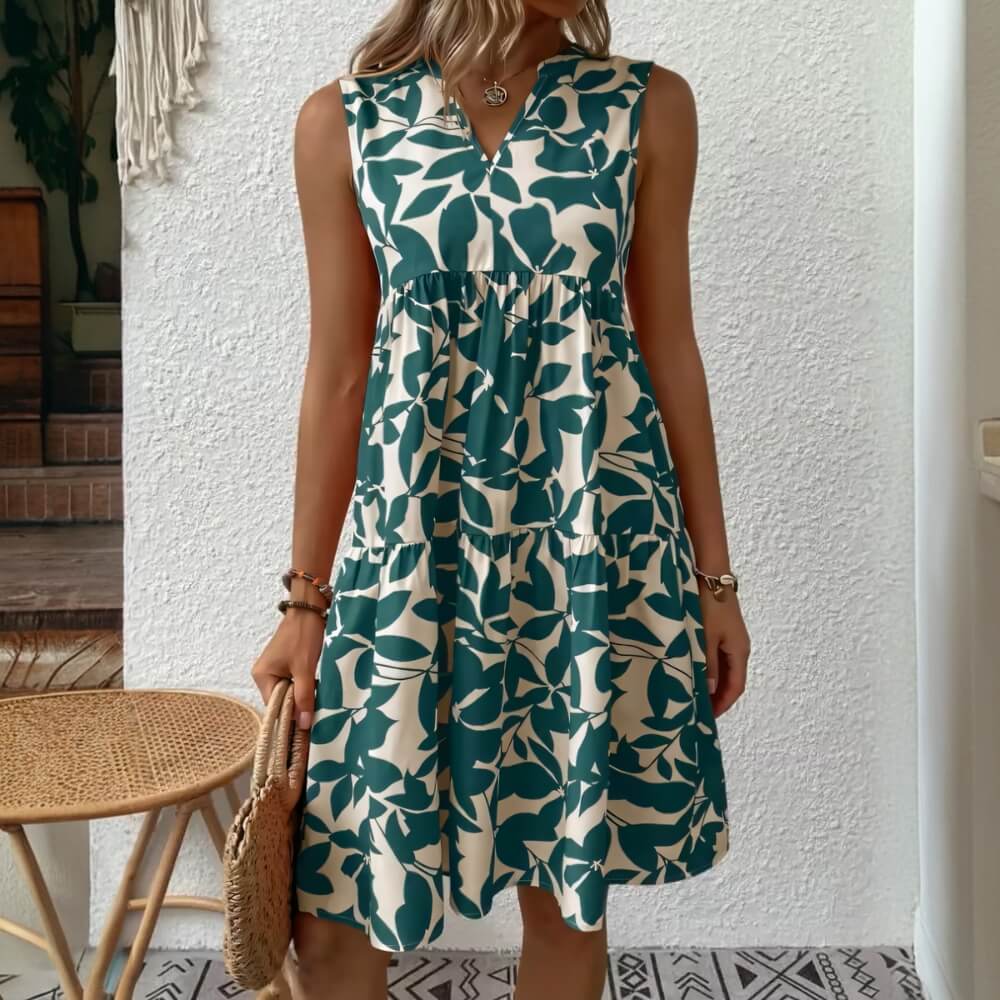 Green sleeveless summer dress with V-neck on the model