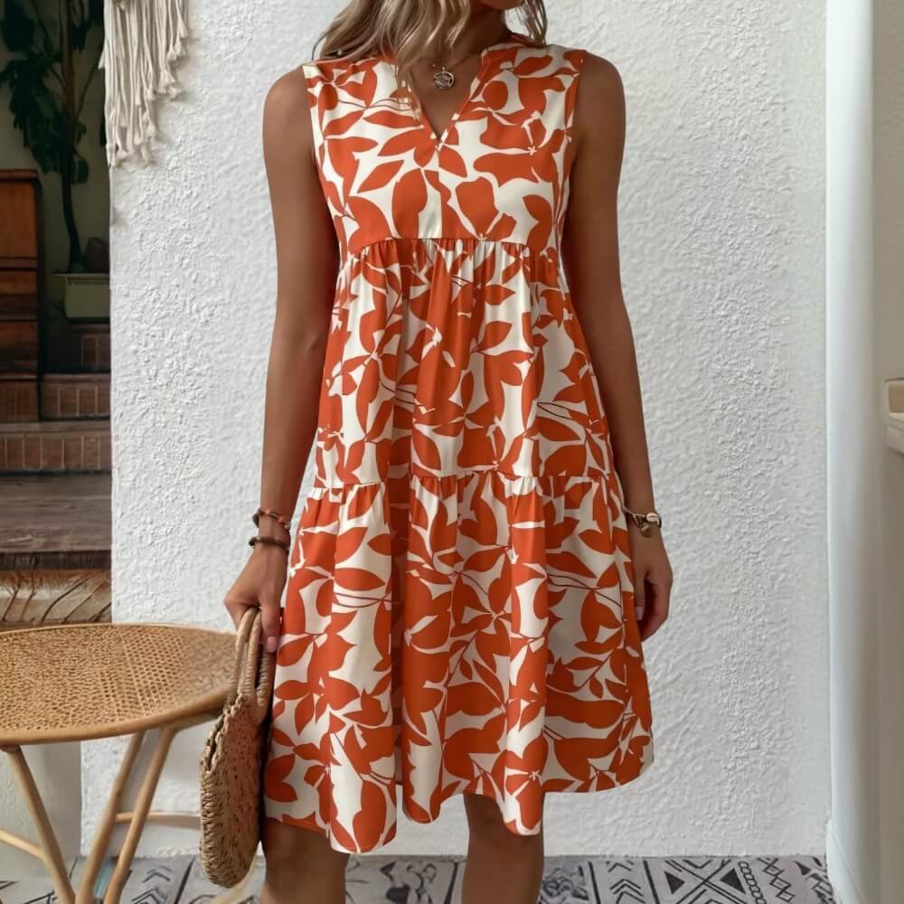 Red sleeveless summer dress with V-neck on the model