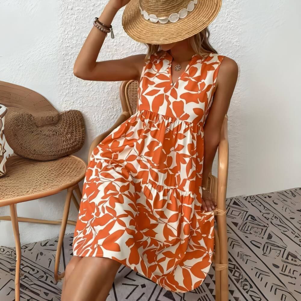 Red sleeveless summer dress with V-neck on the model