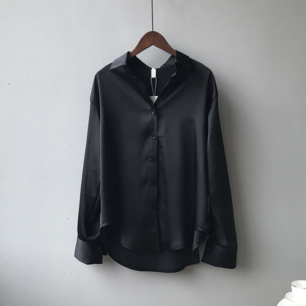 Black loose satin blouse on the model