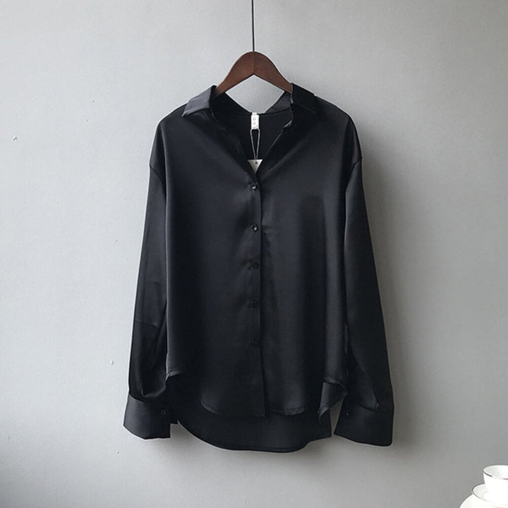 Black loose satin blouse on the model