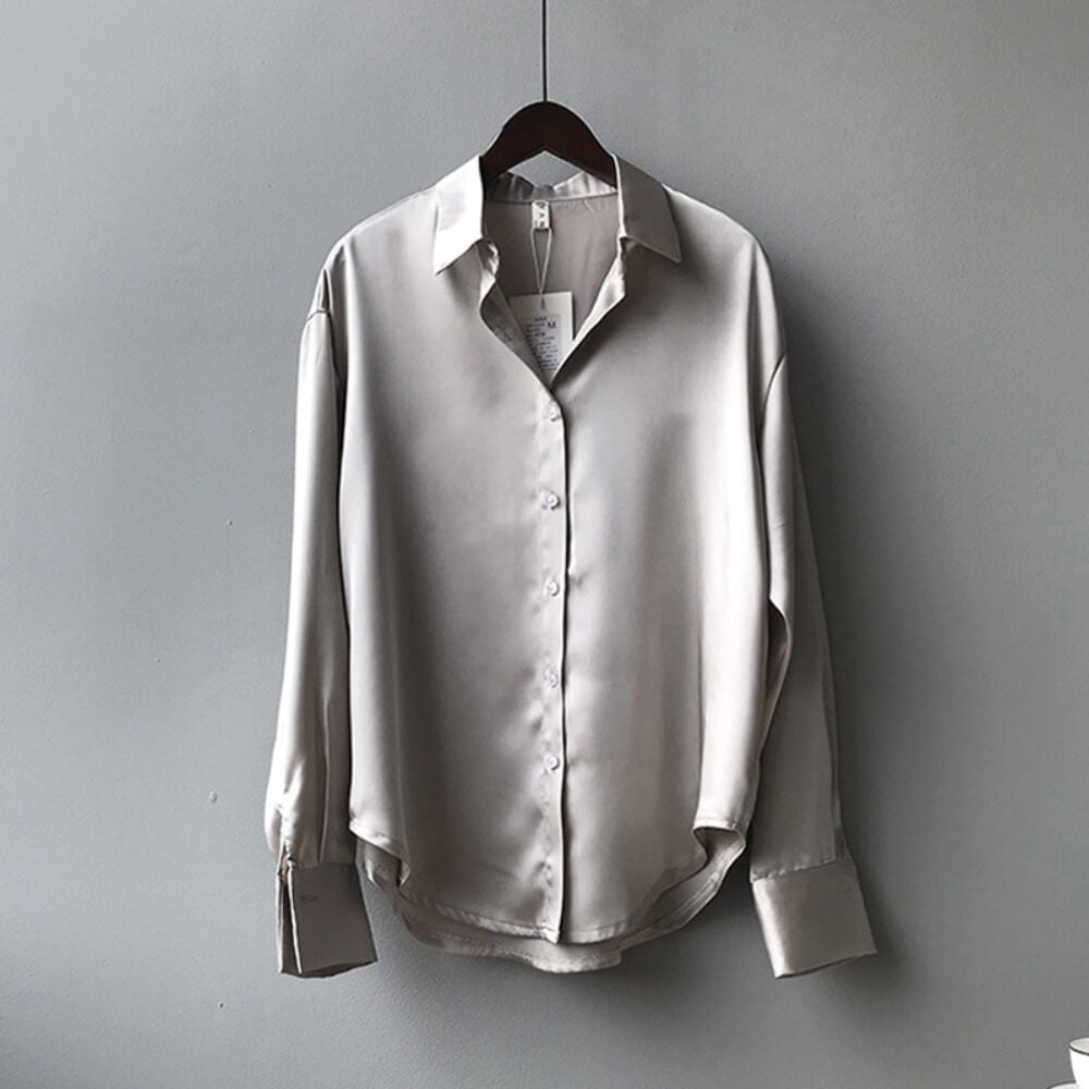 Grey loose satin blouse on the model