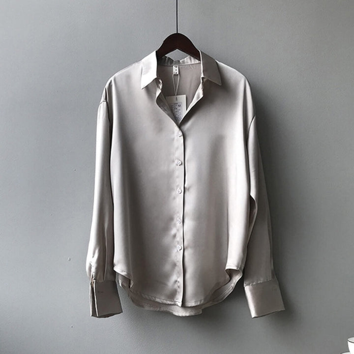 Grey loose satin blouse on the model