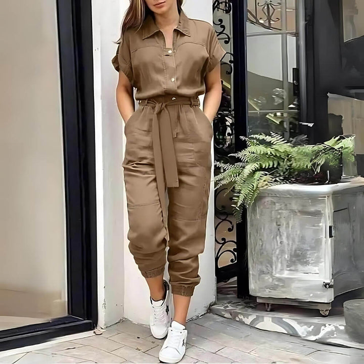 Khaki short-sleeved jumpsuit on the model