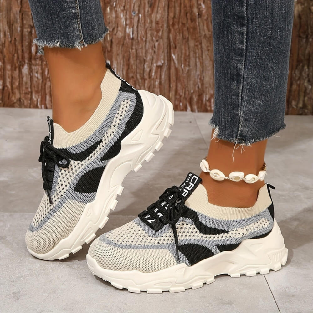 Beige orthopaedic breathable trainers on model