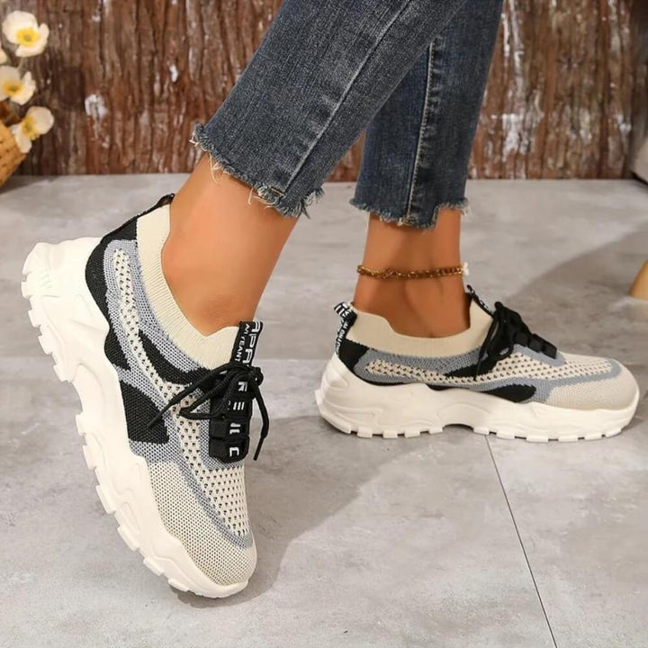 Beige orthopaedic breathable trainers on model
