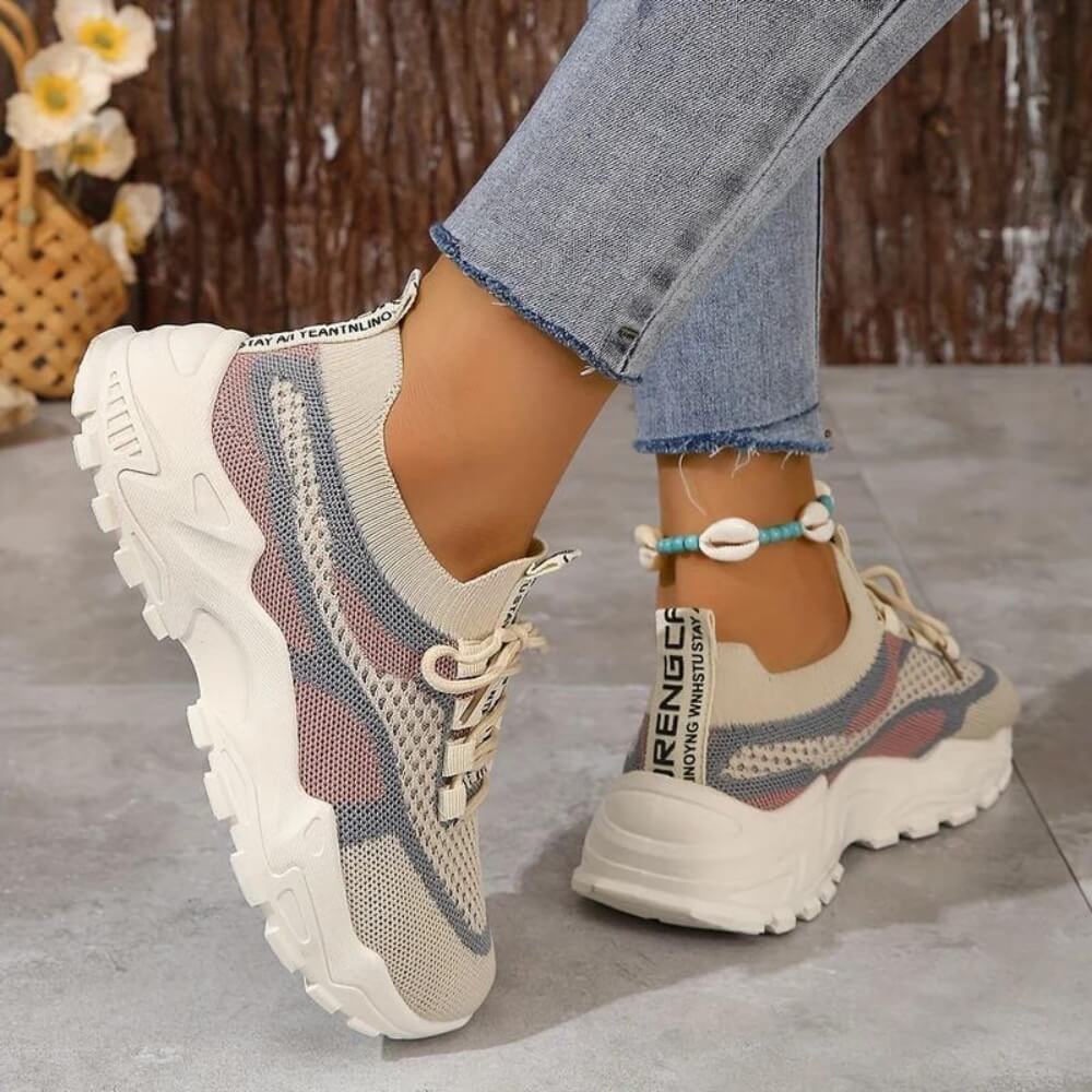 Pink orthopaedic breathable trainers on model