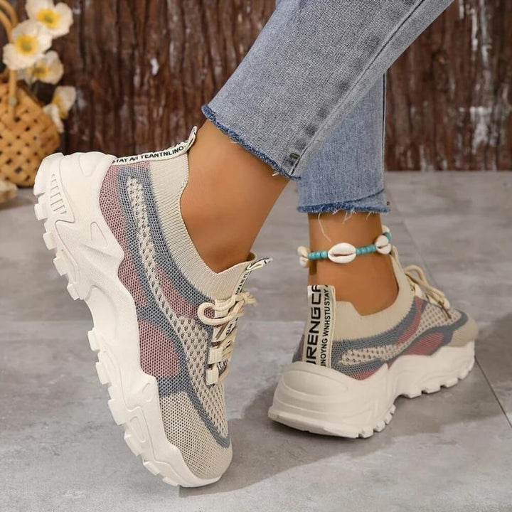 Pink orthopaedic breathable trainers on model