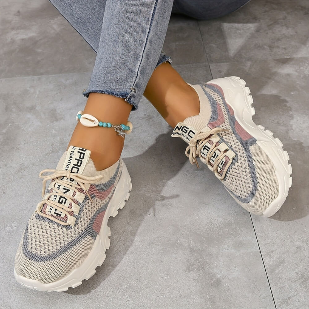 Pink orthopaedic breathable trainers on model